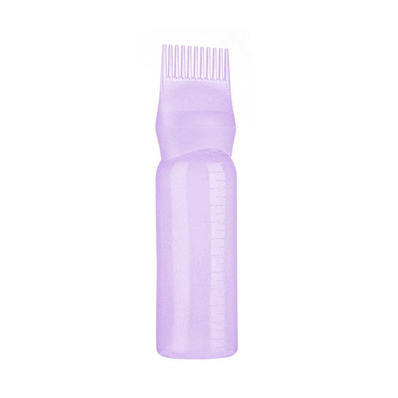 Garrafa de cabelo vazio com pincel aplicador.
